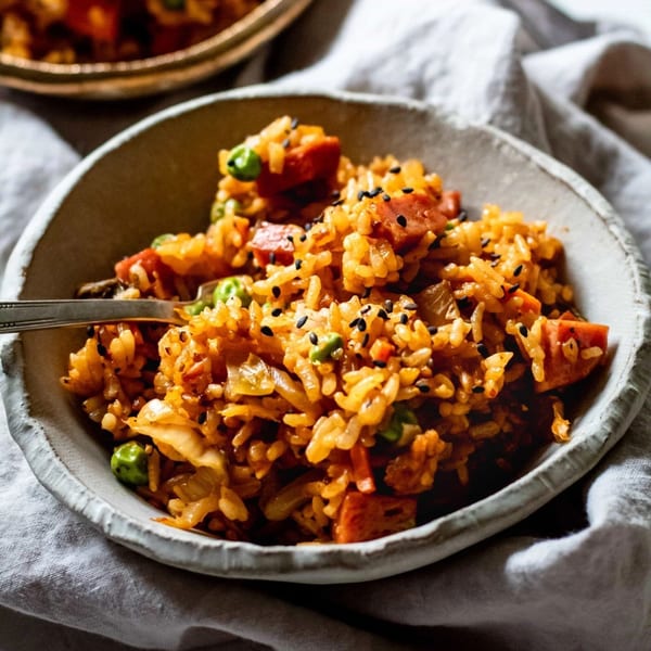 Close-up of Hornbill Sushi & Asian Fusion's kimchi fried rice with peas and sausage.